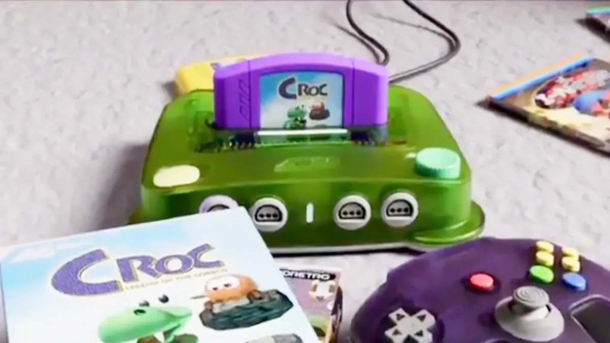 Boîte en carton et cartouche violette de Croc Legend of the Gobbos sur console ModRetro M64 et Nintendo 64